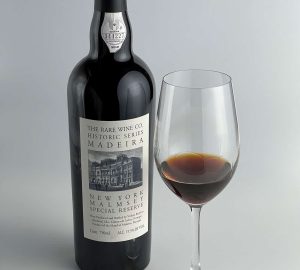 Hyde Park Fine Wines photo of bottle of Madeira wine with wine in a glass.